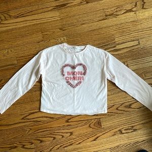 Pink shirt with heart appliqué